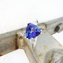 White Gold Double Claw Trilliant Cut Tanzanite With Diamond Shoulder Highlight Ring