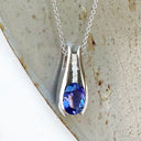Split White Gold Oval Tanzanite Pendant with Diamond Stripe Highlight