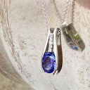 Split White Gold Oval Tanzanite Pendant with Diamond Stripe Highlight