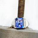 Eye-Catching Emerald Cut Tanzanite With Glam Side Diamond Highlight White Gold Ring
