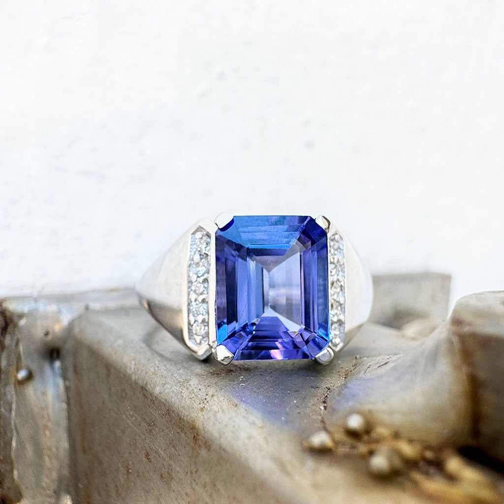 Eye-Catching Emerald Cut Tanzanite With Glam Side Diamond Highlight White Gold Ring