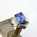Eye-Catching Emerald Cut Tanzanite With Glam Side Diamond Highlight White Gold Ring