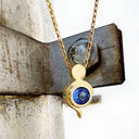 Tanzanite Pendant With Yellow Gold Bead and Curve Detail