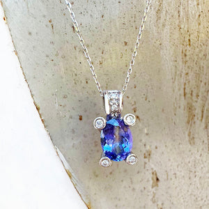 Gorgeous Oval Cut Tanzanite with Diamond Claw, Bale and Band Accent Pendant