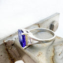 Grandly Elevated Emerald Cut Tanzanite Solitaire White Gold Ring