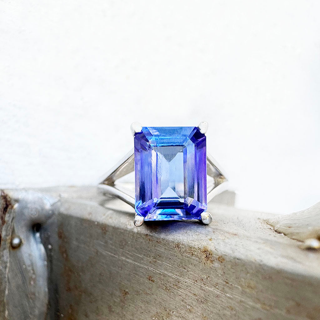 Grandly Elevated Emerald Cut Tanzanite Solitaire White Gold Ring