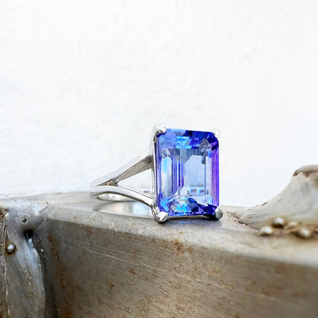 Regal Elevated Emerald Cut Tanzanite Solitaire White Gold Ring