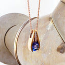 Split Rose Gold Round Tanzanite Pendant with Diamond Stripe Highlight
