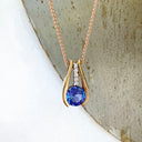 Split Rose Gold Round Tanzanite Pendant with Diamond Stripe Highlight
