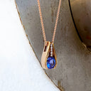 Split Rose Gold Round Tanzanite Pendant with Diamond Stripe Highlight