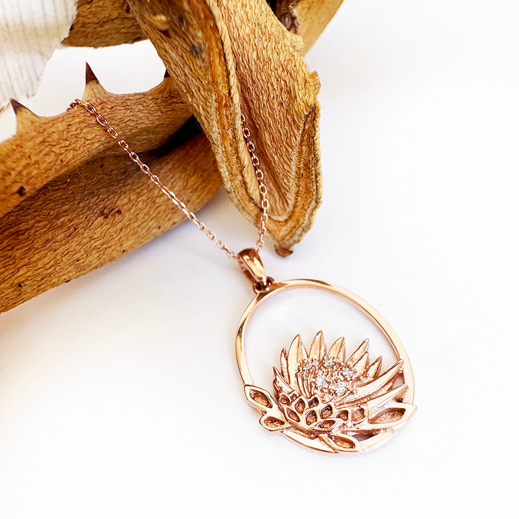 Oval Cut Out Protea Pendant with Diamonds in Rose Gold