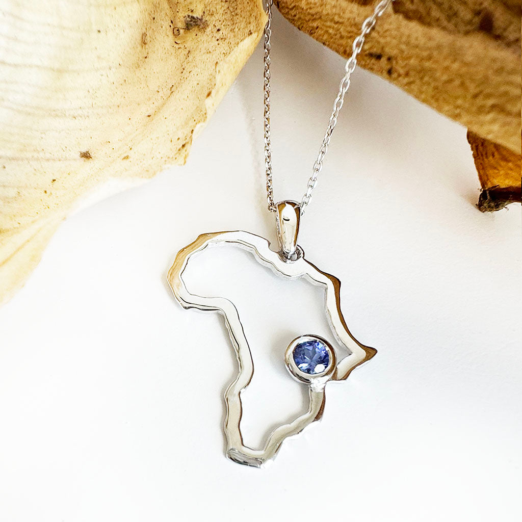 Elegantly Styled White Gold Africa Map pendant with Bezel Set Tanzanite Highlight Pendant