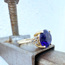 Visionary Round Cut Tanzanite With Trilogy Shoulder Highlight Yellow Gold Ring