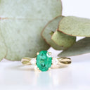 Lightly Crimped Oval Cut Emerald and Diamond Highlight Ring