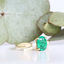 Lightly Crimped Oval Cut Emerald and Diamond Highlight Ring