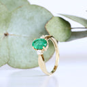 Lightly Crimped Oval Cut Emerald and Diamond Highlight Ring