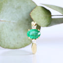 Lightly Crimped Oval Cut Emerald and Diamond Highlight Ring