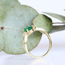 Lightly Crimped Oval Cut Emerald and Diamond Highlight Ring