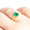 Lightly Crimped Oval Cut Emerald and Diamond Highlight Ring
