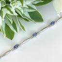 Silver Single Wave Oval Cut Tanzanite and Petite Diamond Highlight Bracelet