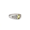 Ornate Oval Cut Peridot Ring with Diamond Step Detail