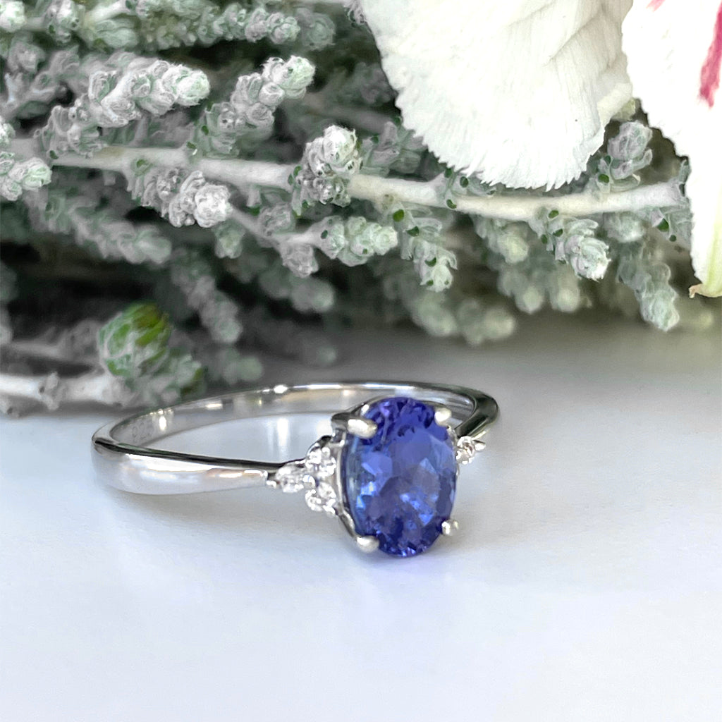 Silver Oval Cut Tanzanite with Trilogy Silver Topaz Highlight Ring