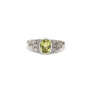 Ornate Oval Cut Peridot Ring with Diamond Step Detail