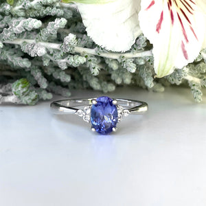 Silver Oval Cut Tanzanite with Trilogy Silver Topaz Highlight Ring