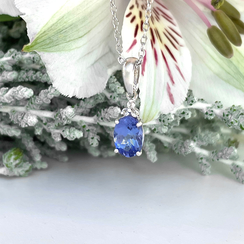 Silver Oval Cut Tanzanite with Trilogy Silver Topaz Highlight Pendant