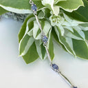 Silver Single Wave Oval Cut Tanzanite and Petite Diamond Highlight Bracelet