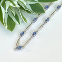 Silver Single Wave Oval Cut Tanzanite and Petite Diamond Highlight Bracelet