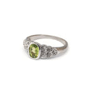Ornate Oval Cut Peridot Ring with Diamond Step Detail