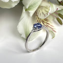 Silver Petite Round Cut Tanzanite with Trilogy Diamond Highlight Ring
