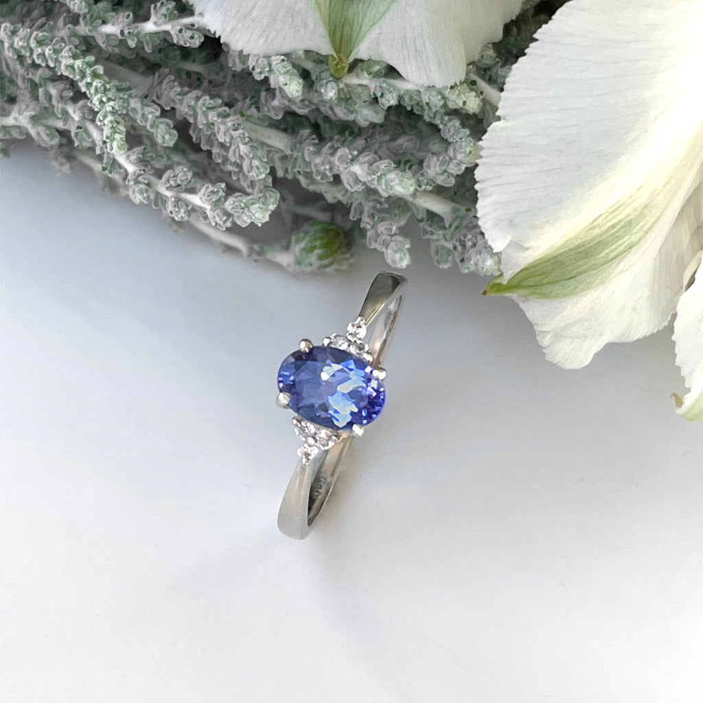 Silver Oval Cut Tanzanite with Trilogy Silver Topaz Highlight Ring