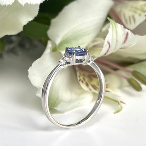 Silver Petite Round Cut Tanzanite with Trilogy Diamond Highlight Ring