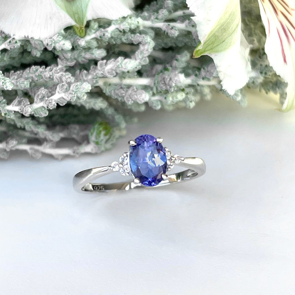 Silver Oval Cut Tanzanite with Trilogy Silver Topaz Highlight Ring