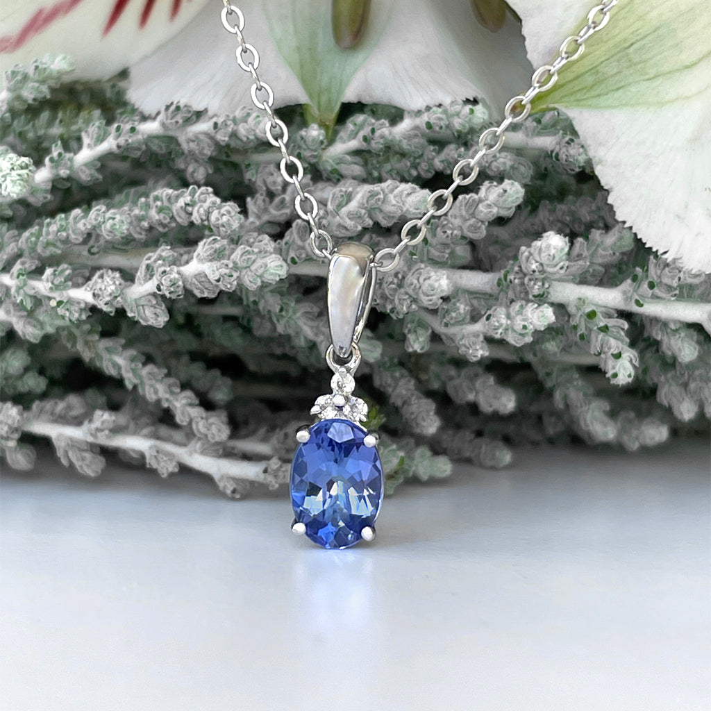 Silver Oval Cut Tanzanite with Trilogy Silver Topaz Highlight Pendant