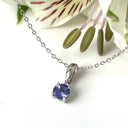 Silver Petite Round Cut Tanzanite with Single Diamond Pendant