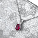 Delicate Split Bale Oval Ruby and Diamond Highlight Pendant