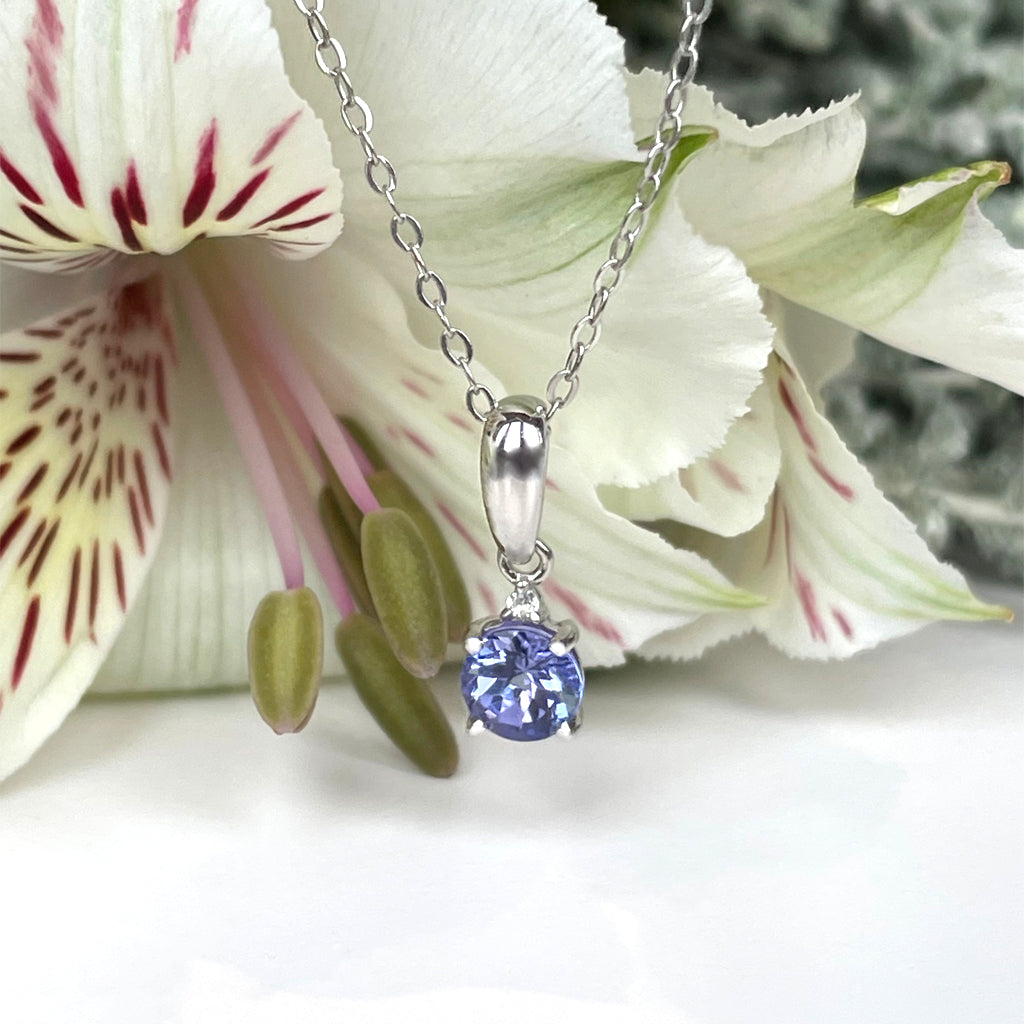 Silver Petite Round Cut Tanzanite with Single Diamond Pendant