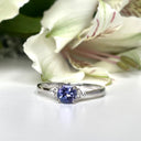Silver Petite Round Cut Tanzanite with Trilogy Diamond Highlight Ring