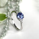 Silver Round Cut Tanzanite with Trilogy Diamond Highlight Ring