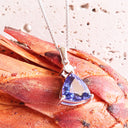 Luxuriously Faceted Trilliant Cut Tanzanite And Diamond Accent White Gold Pendant