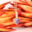 Mesmerising Trilliant Cut Tanzanite And Diamond Bale Rose Gold Pendant