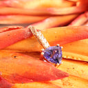 Mesmerising Trilliant Cut Tanzanite And Diamond Bale Rose Gold Pendant