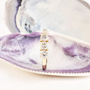 Neatly Bound White Diamond Ring in Yellow Gold