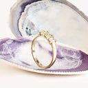 Neatly Bound White Diamond Ring in Yellow Gold
