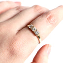 Neatly Bound White Diamond Ring in Yellow Gold