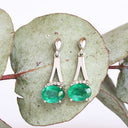 Oval Cut Emerald White Gold Drop Earrings with Diamond Crown Accent