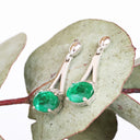 Oval Cut Emerald White Gold Drop Earrings with Diamond Crown Accent